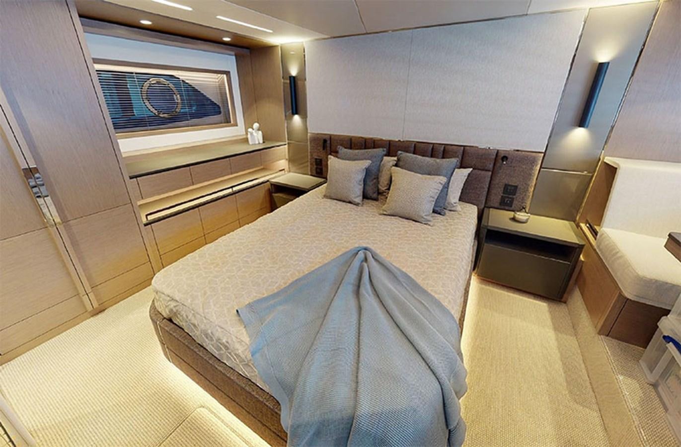 a room with a bed and a window aboard SM Yacht for Sale