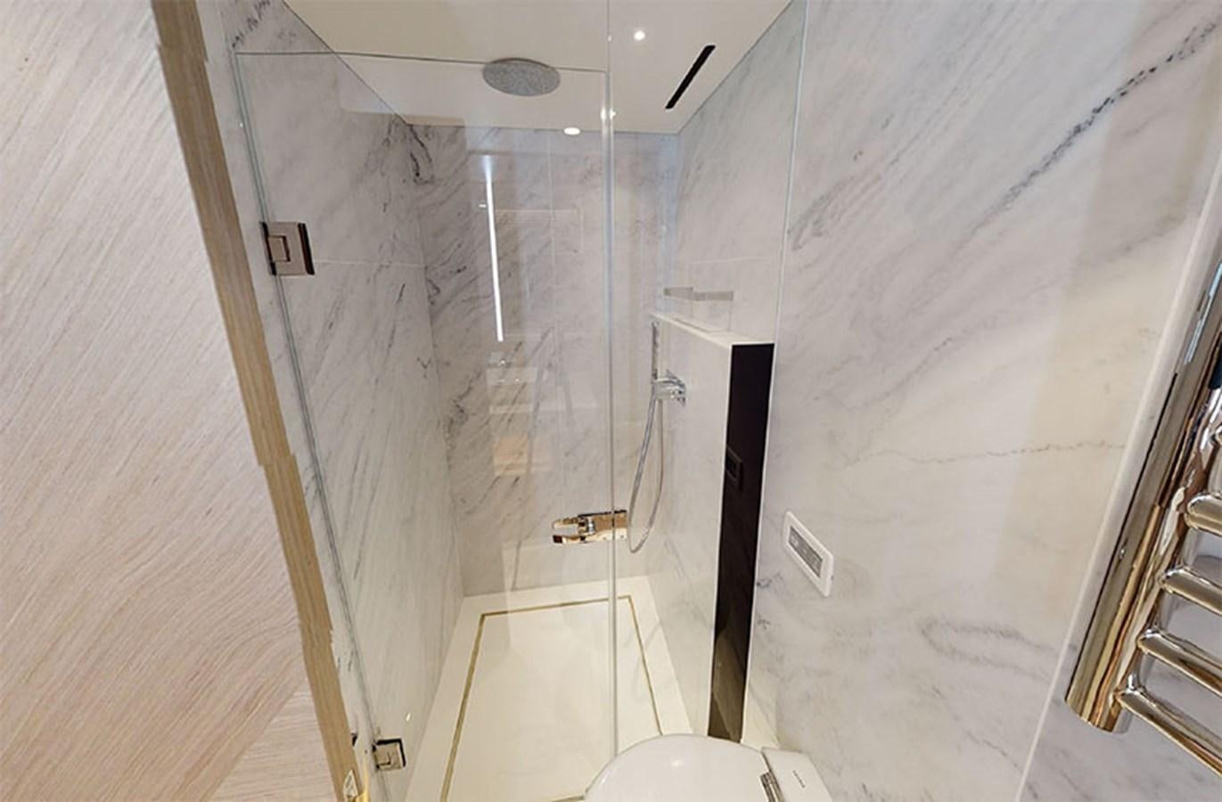 a bathroom with a shower aboard SM Yacht for Sale