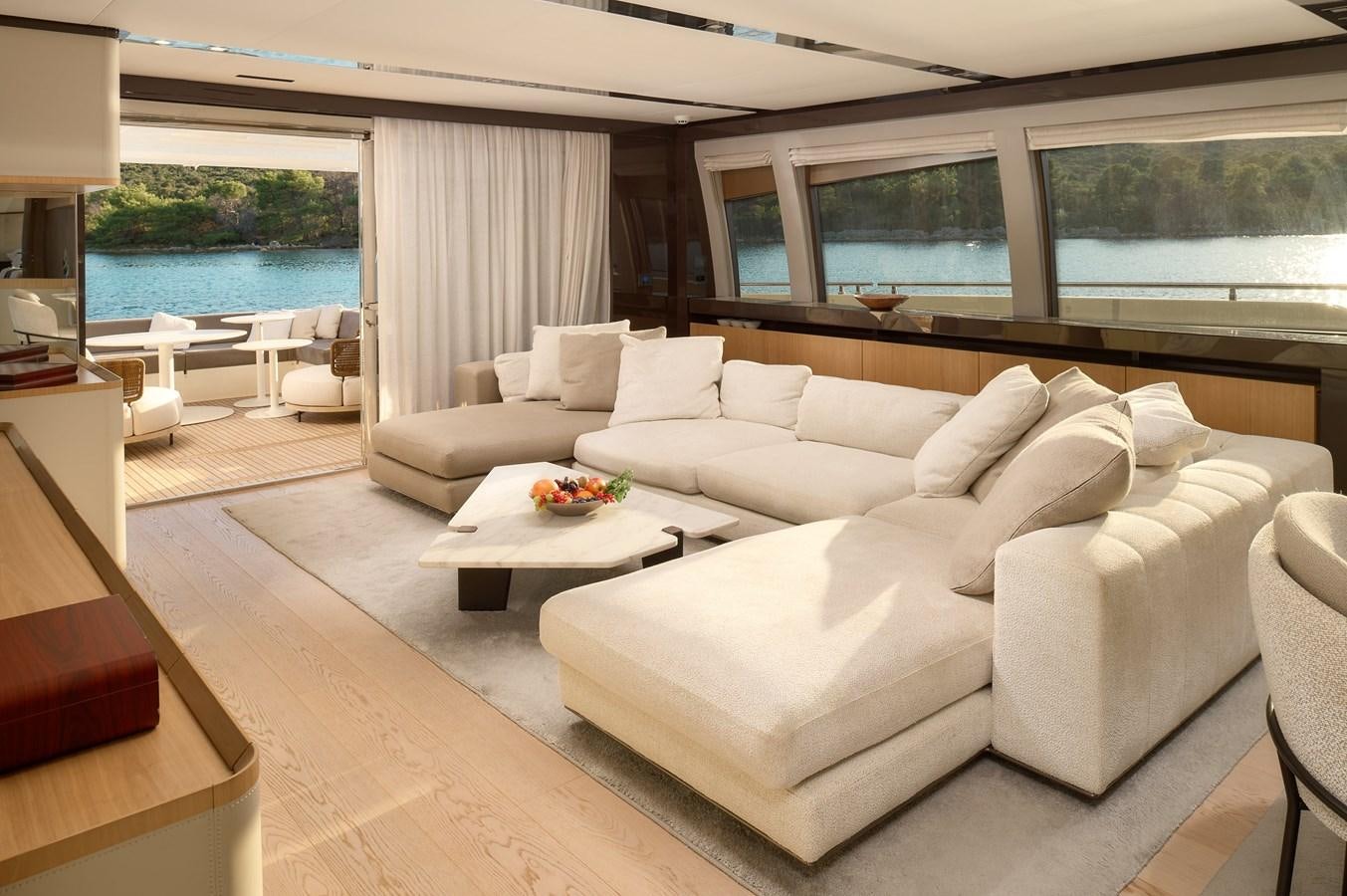 a living room with a large window aboard DAMARI Yacht for Sale