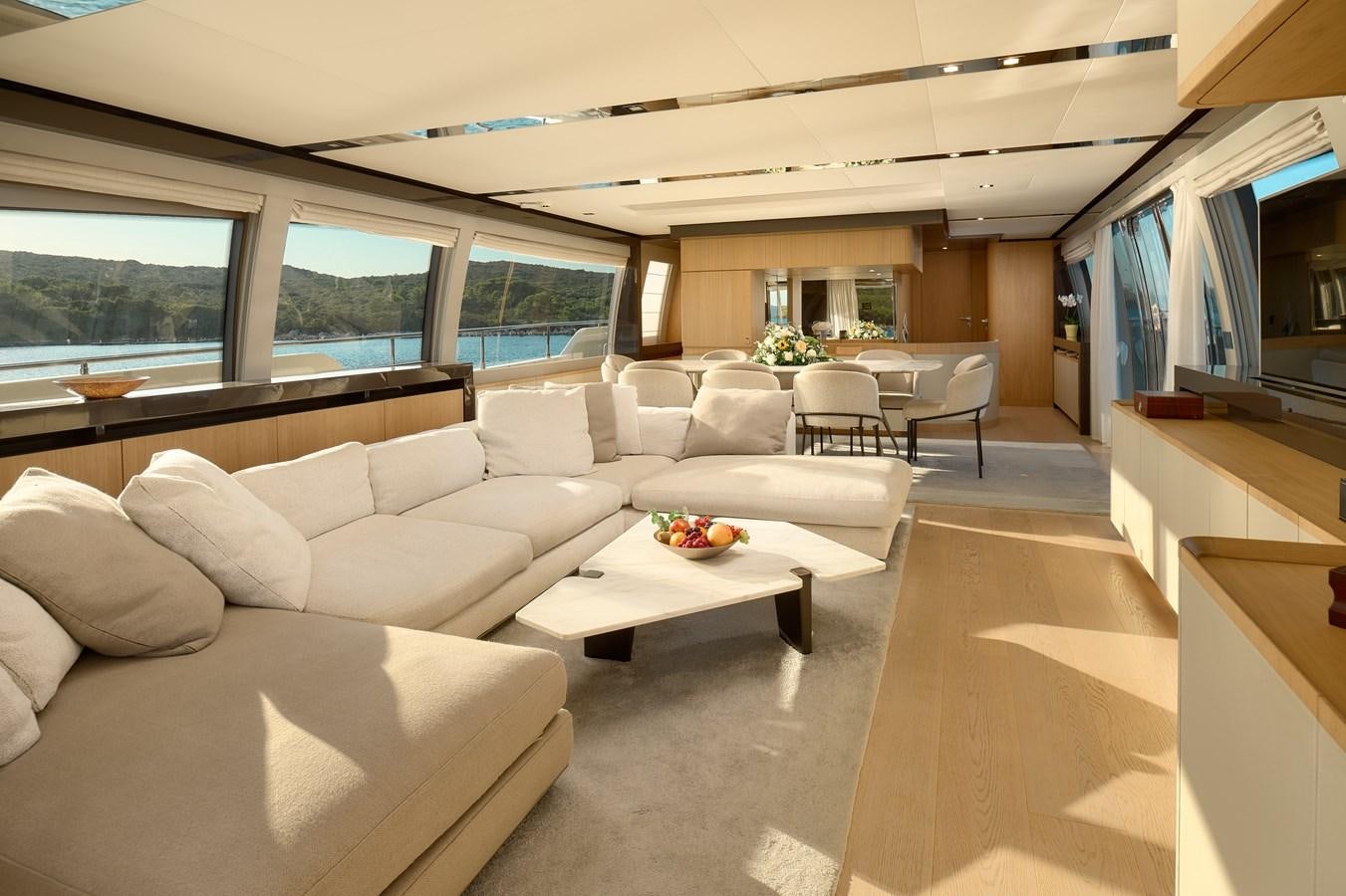 a living room with a large window aboard DAMARI Yacht for Sale