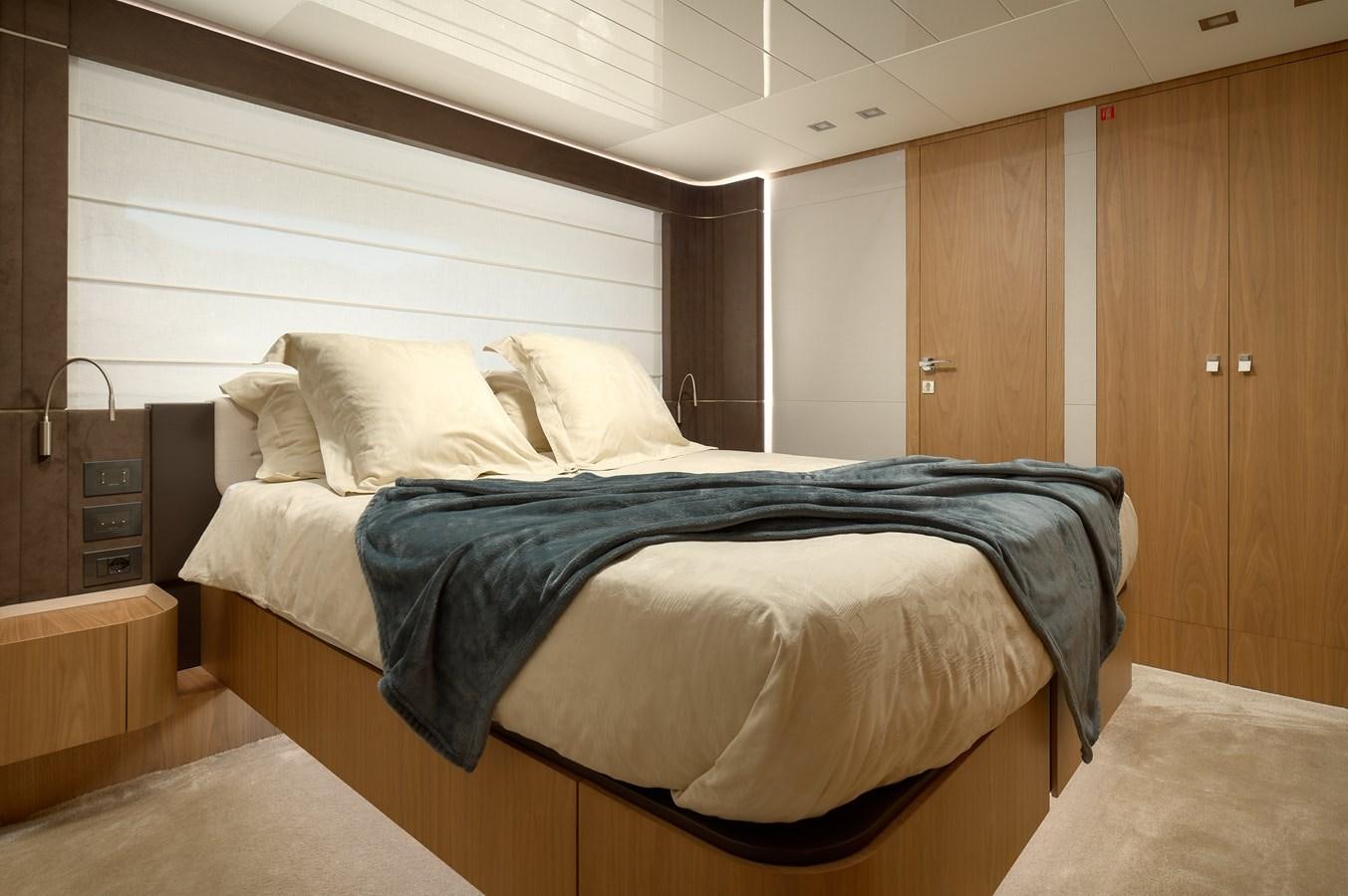 a bed in a room aboard DAMARI Yacht for Sale