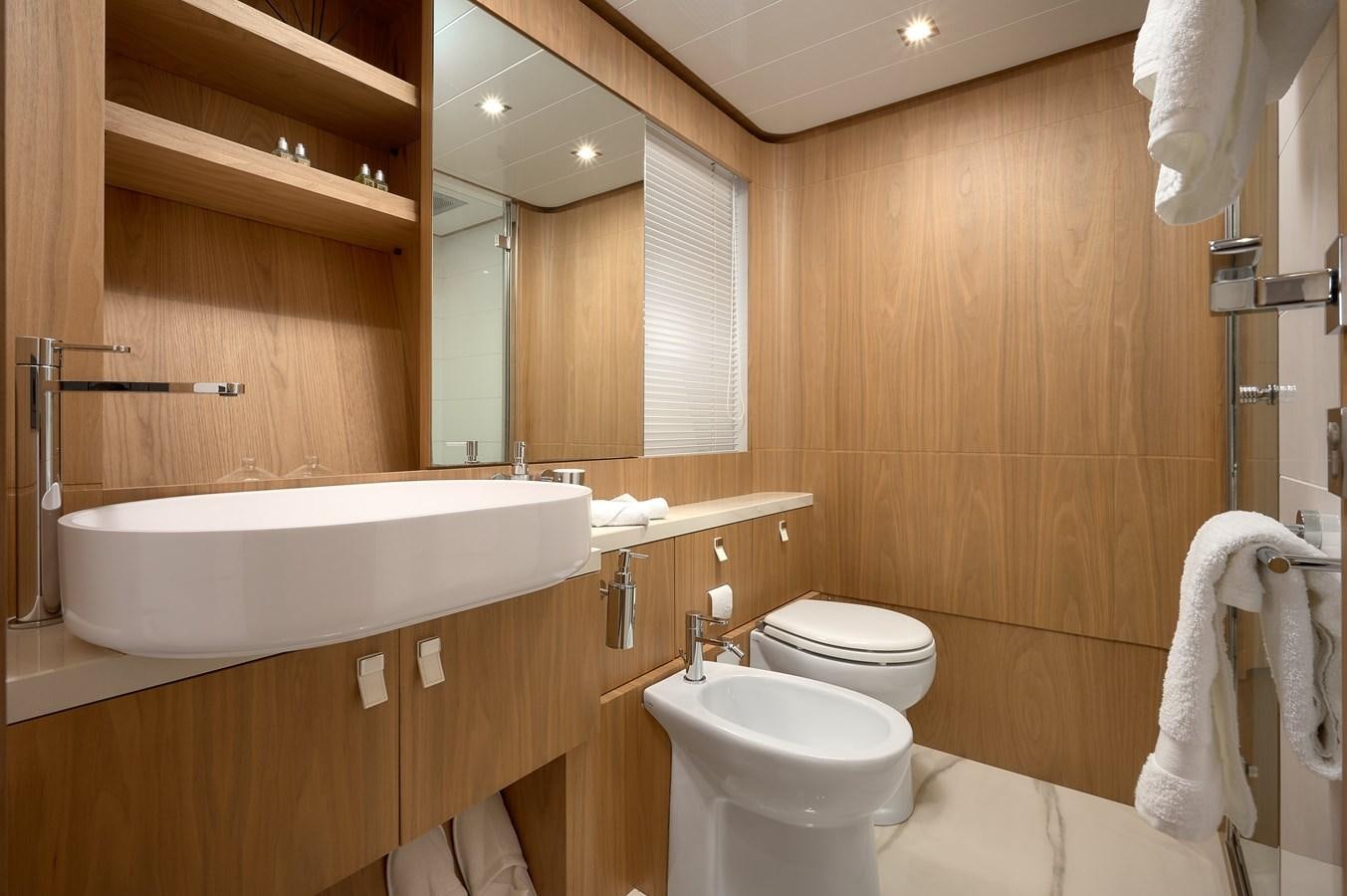 a bathroom with a sink toilet and a bathtub aboard DAMARI Yacht for Sale