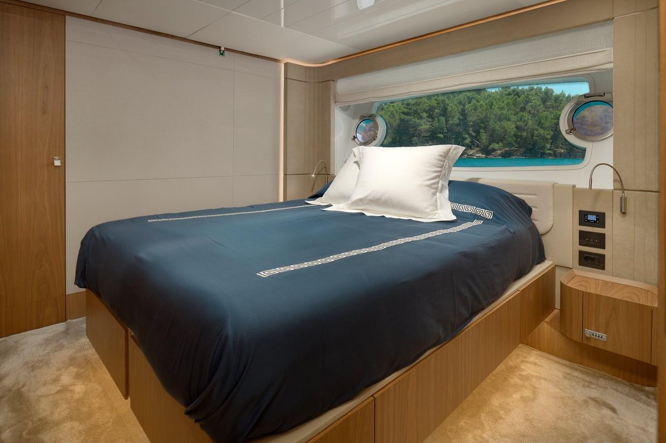 a bed in a room aboard DAMARI Yacht for Sale
