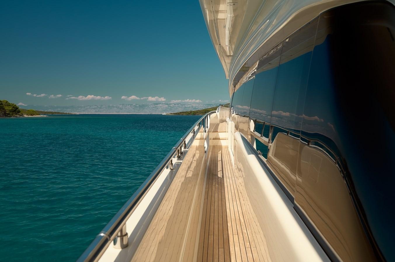 a wooden walkway over water aboard DAMARI Yacht for Sale