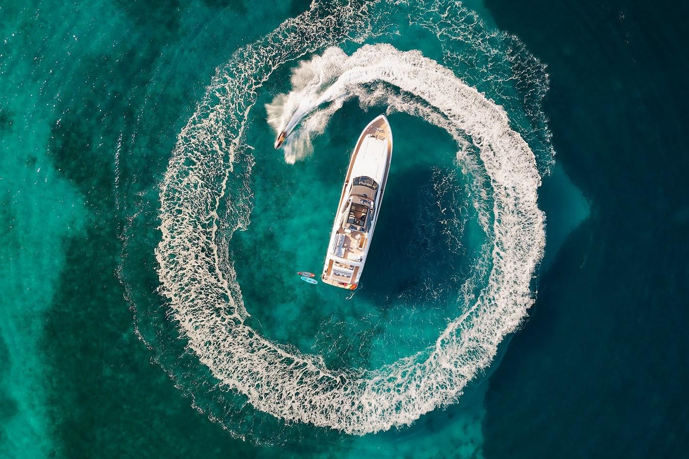 a satellite in the earth with Great Blue Hole in the background aboard DAMARI Yacht for Sale