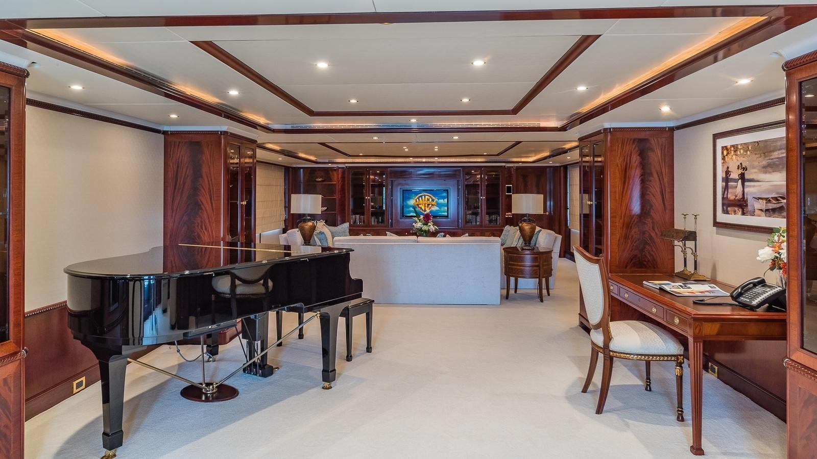 a large room with a table and chairs aboard BELLA Yacht for Sale