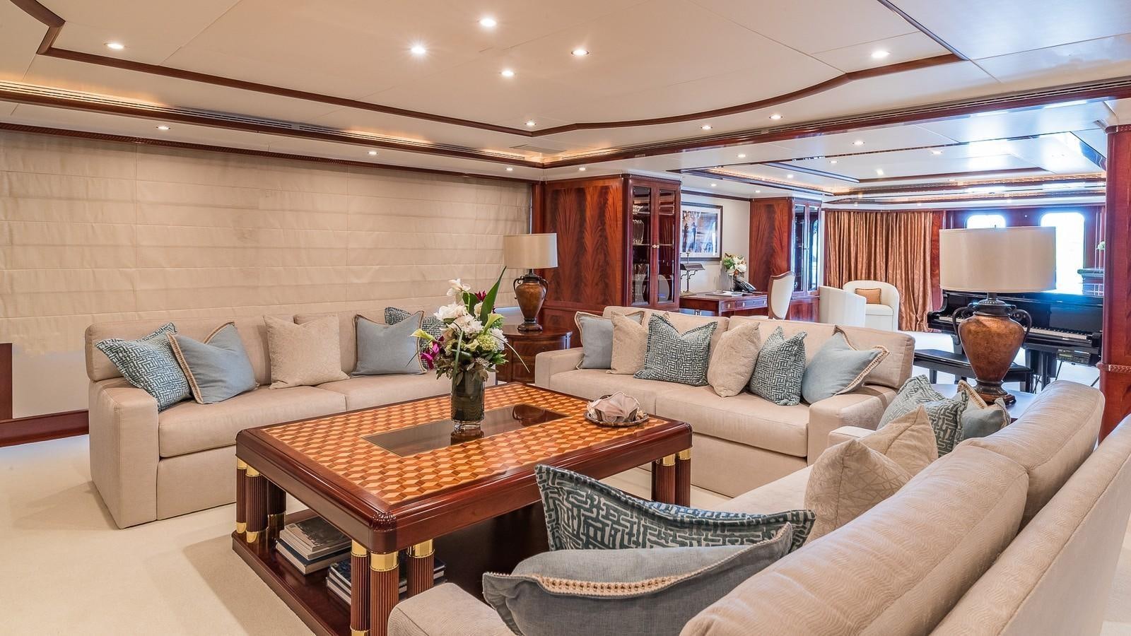 a living room with a couch and a table aboard BELLA Yacht for Sale