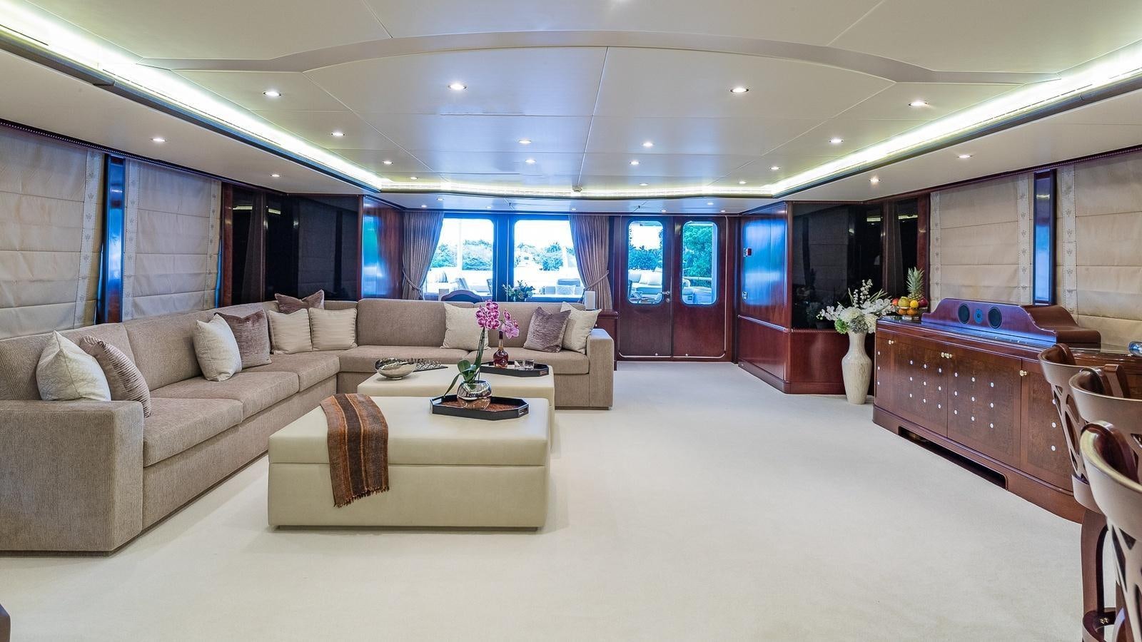 a living room with a couch and a table aboard BELLA Yacht for Sale