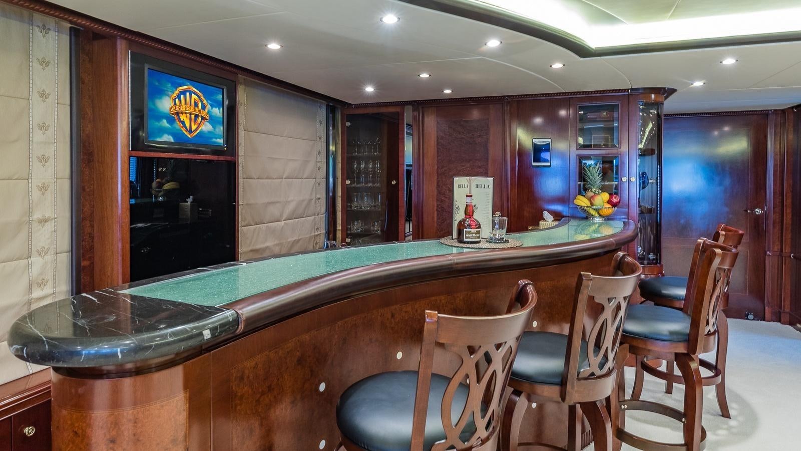 a large bar with chairs around it aboard BELLA Yacht for Sale