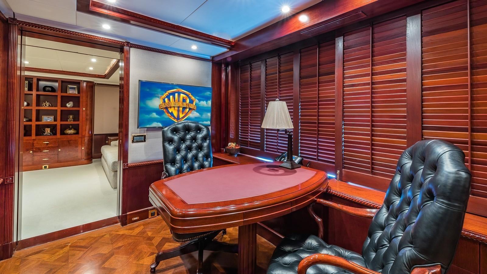 a room with a table and chairs aboard BELLA Yacht for Sale