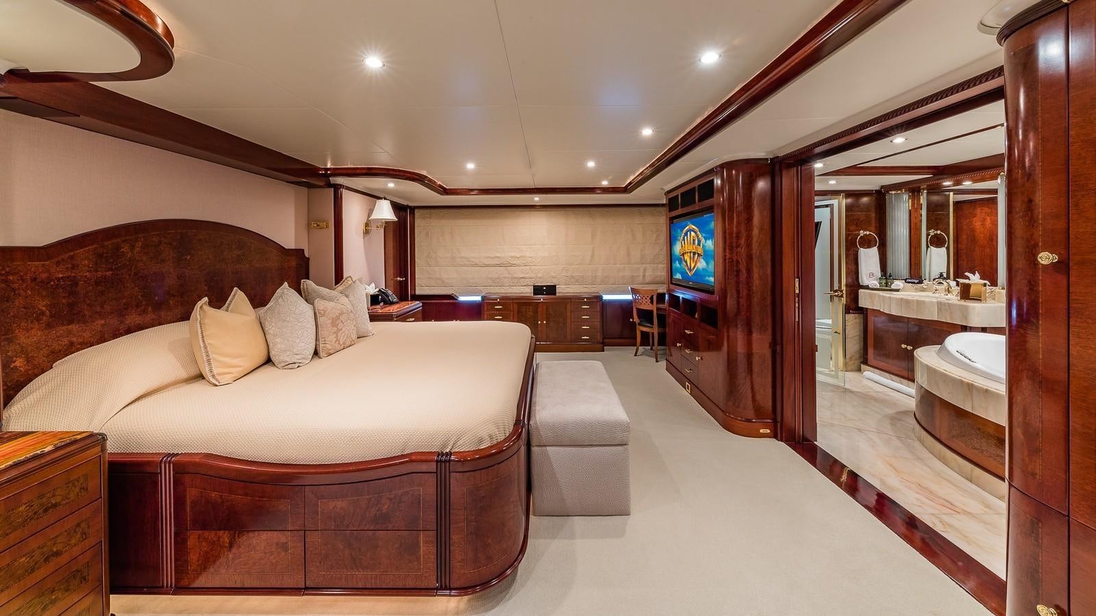 a large bedroom with a bed aboard BELLA Yacht for Sale
