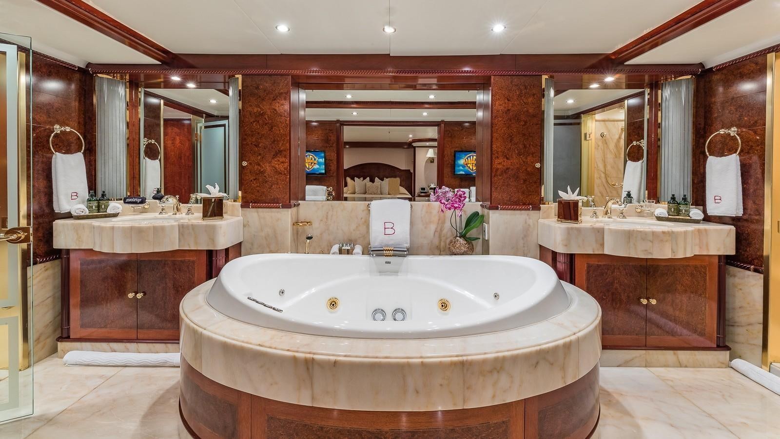 a large bathroom with a large bathtub aboard BELLA Yacht for Sale