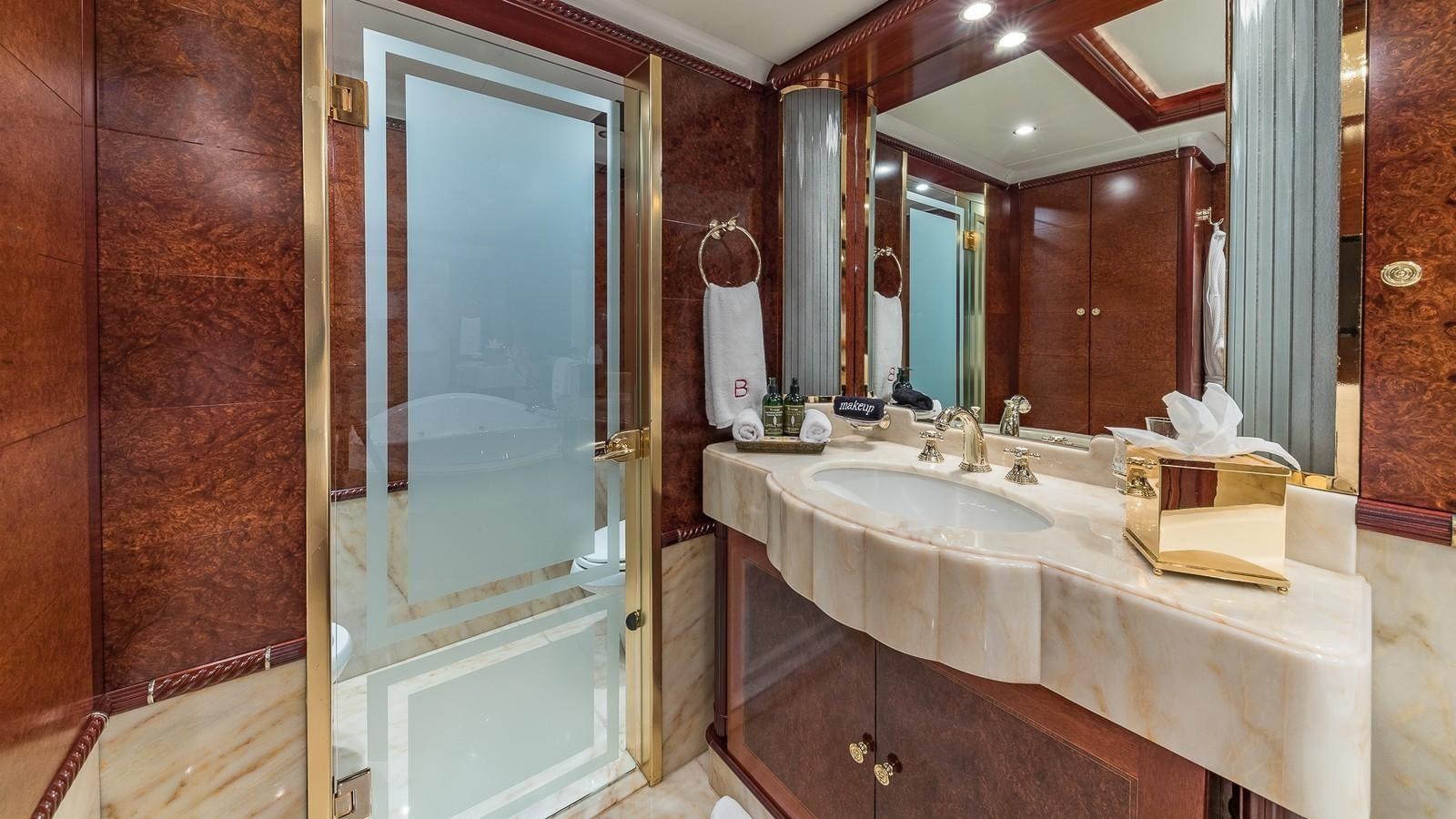 a bathroom with a large mirror aboard BELLA Yacht for Sale