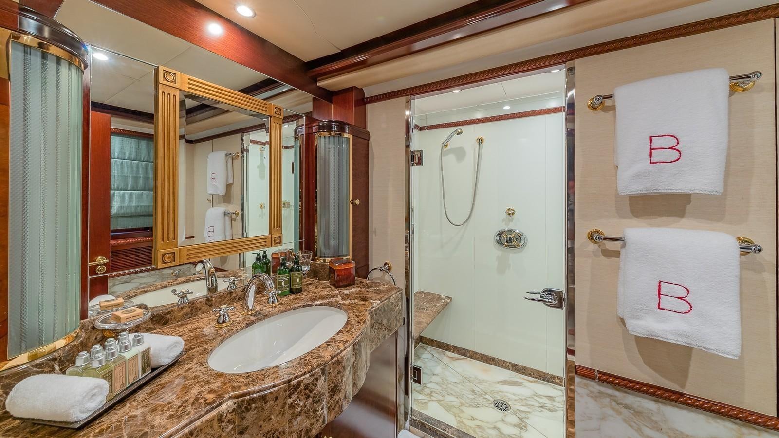 a bathroom with a sink and a bathtub aboard BELLA Yacht for Sale
