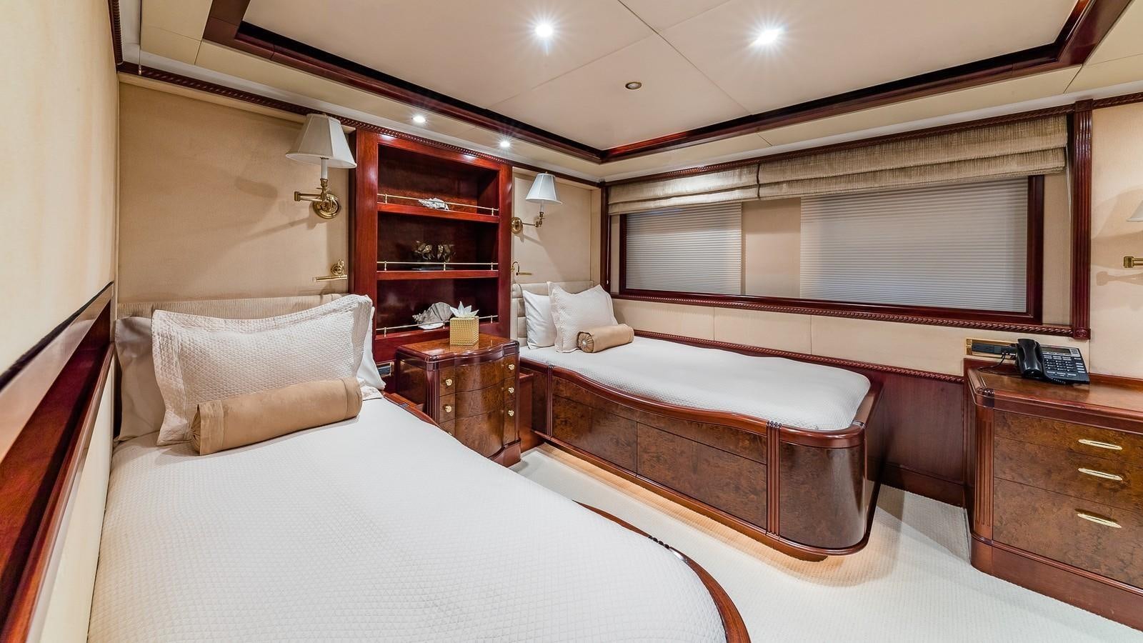 a room with two beds aboard BELLA Yacht for Sale