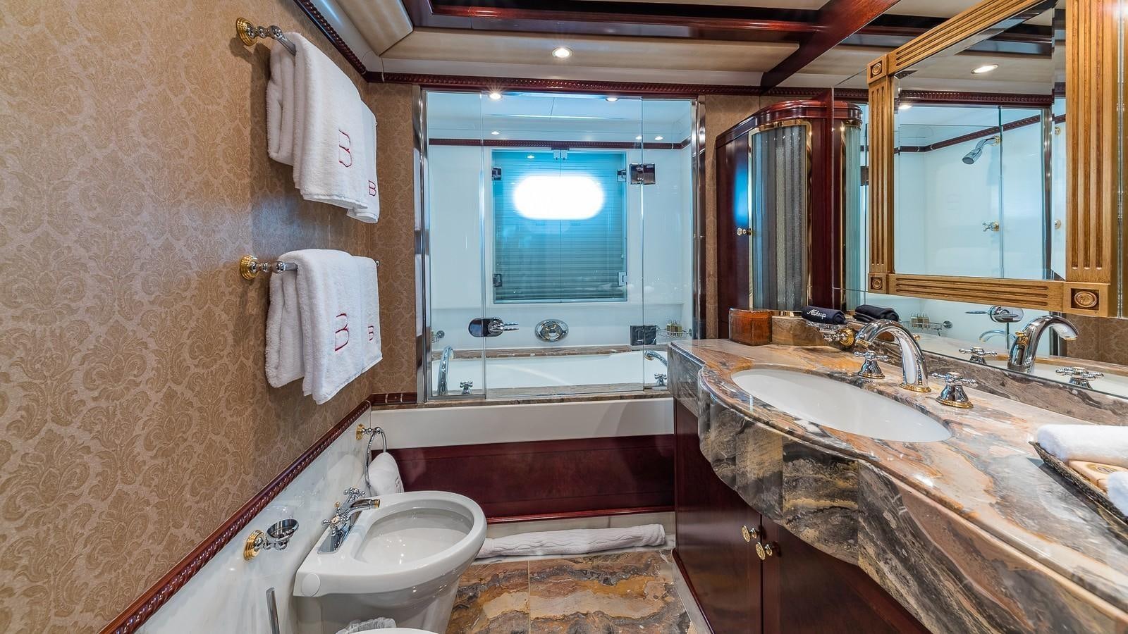 a bathroom with a large window aboard BELLA Yacht for Sale