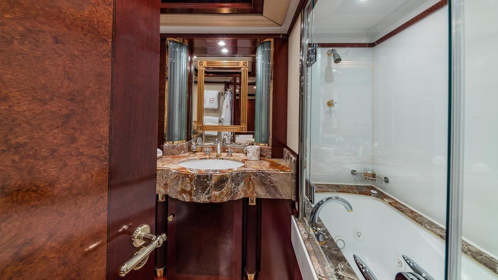 a bathroom with a sink and a mirror aboard BELLA Yacht for Sale