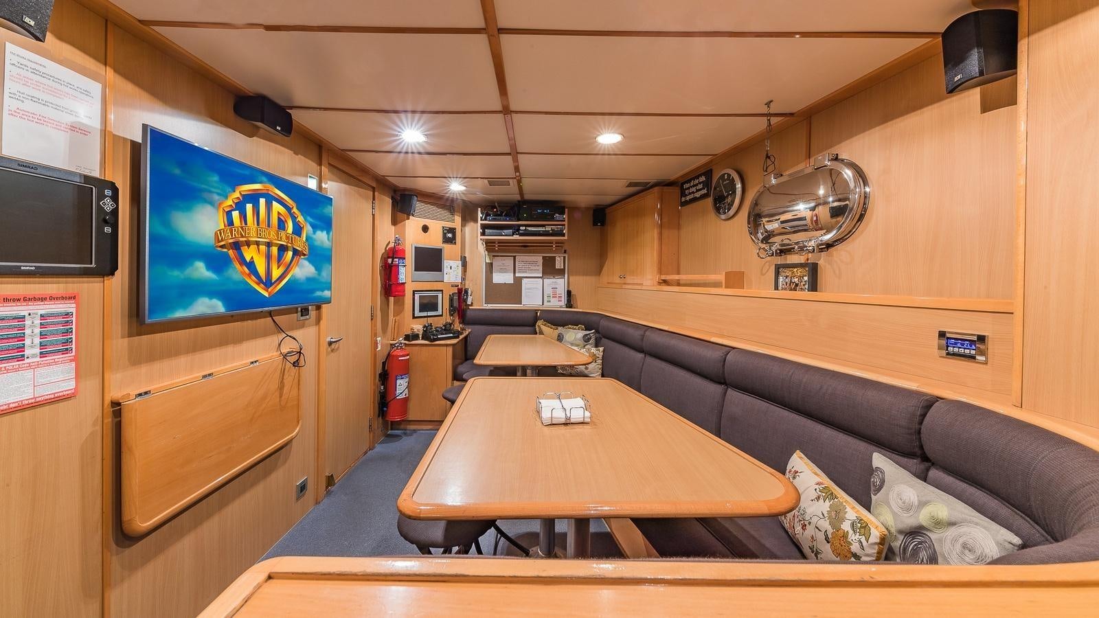 a living room with a couch and a table aboard BELLA Yacht for Sale