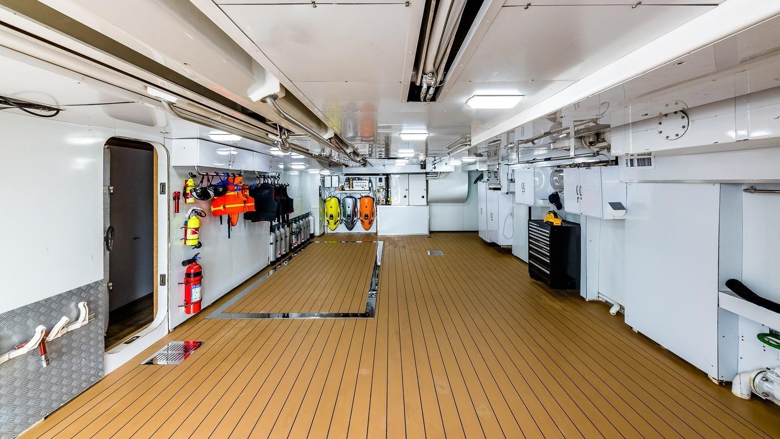 a long hallway with a few doors aboard BELLA Yacht for Sale