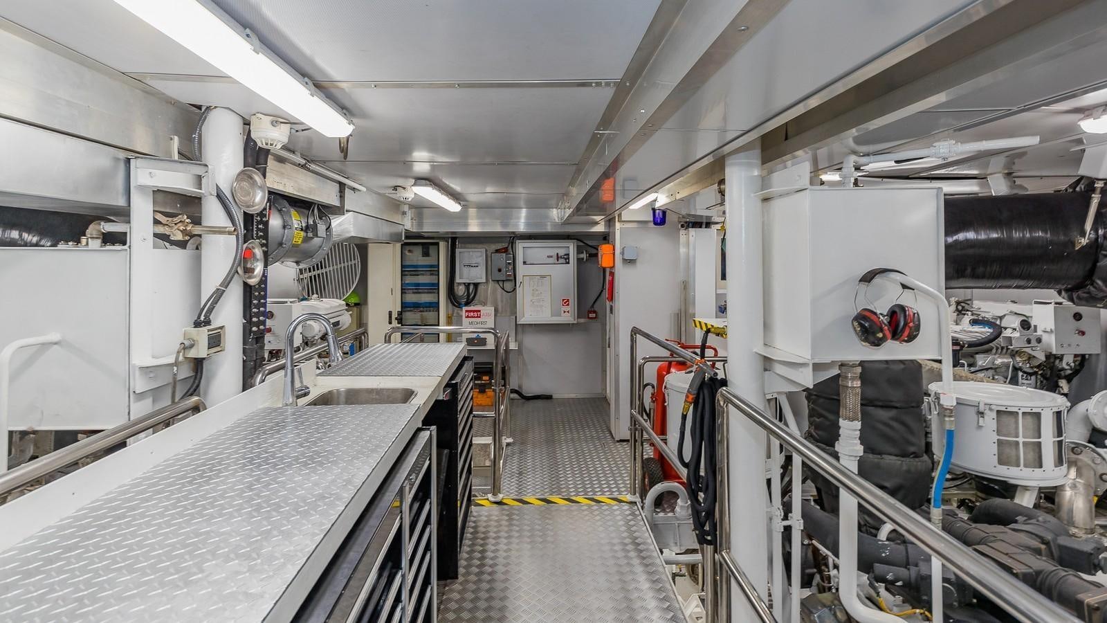 a room with white walls and pipes aboard BELLA Yacht for Sale