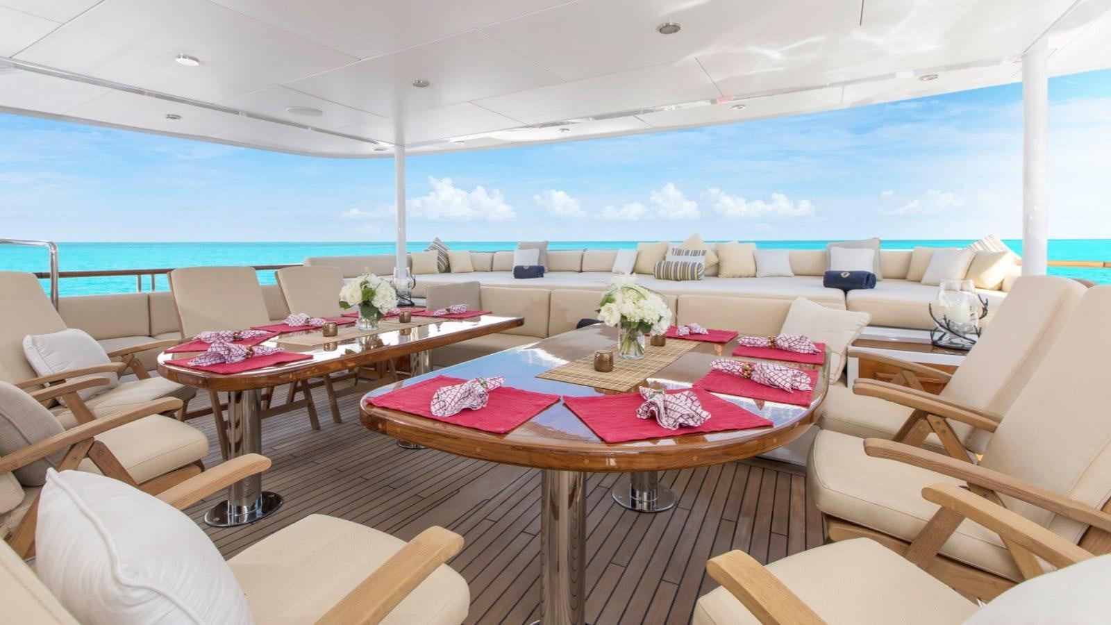a room with a table and chairs aboard BELLA Yacht for Sale