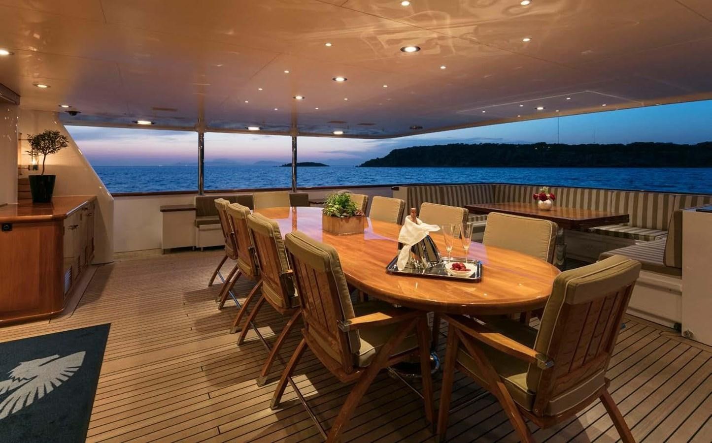a room with a table and chairs aboard PEGASUS Yacht for Sale