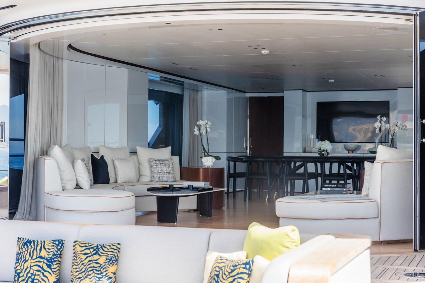 a living room with a large window aboard TOSUN Yacht for Sale
