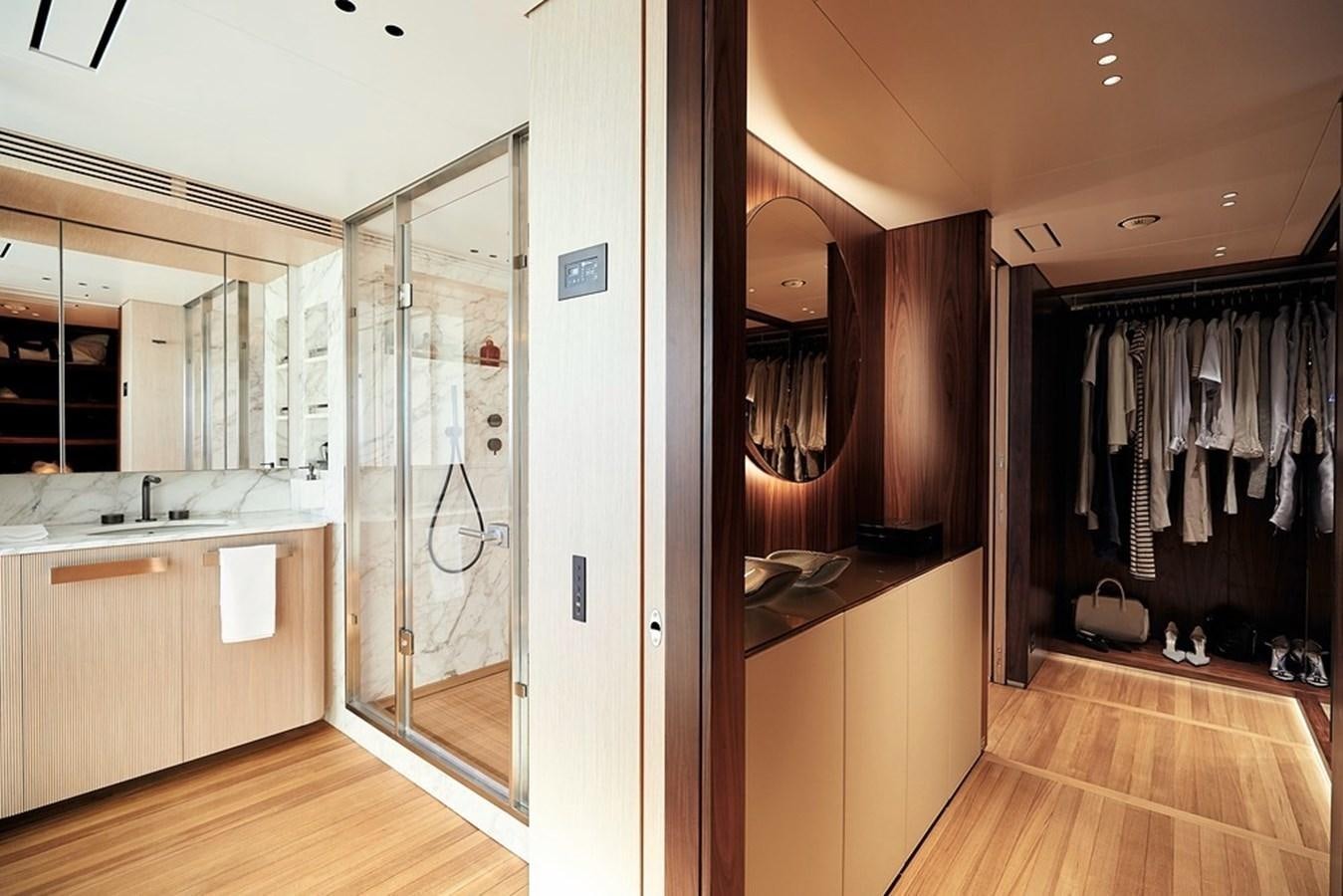 a bathroom with a large mirror aboard TOSUN Yacht for Sale
