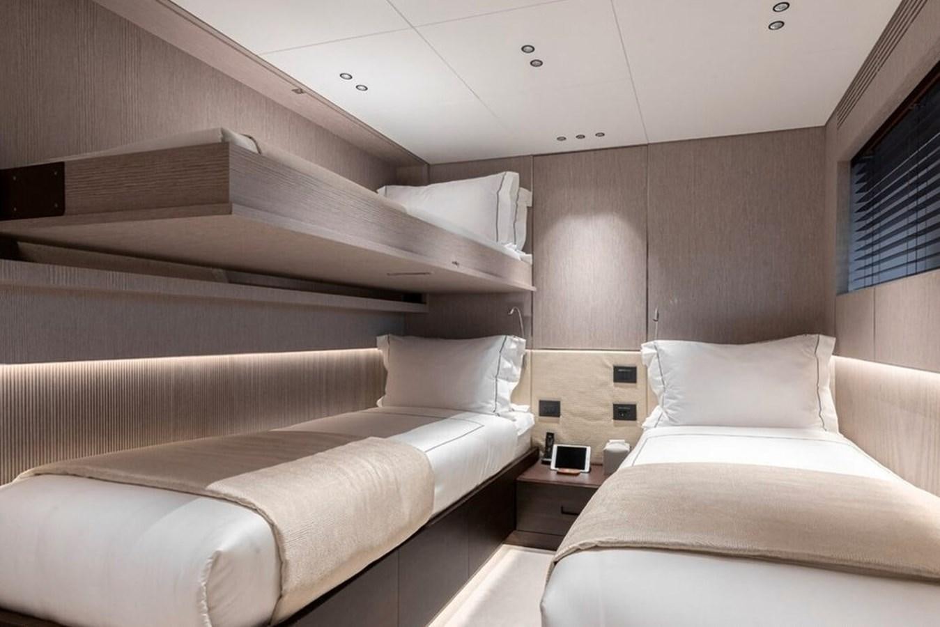 a room with two beds aboard TOSUN Yacht for Sale