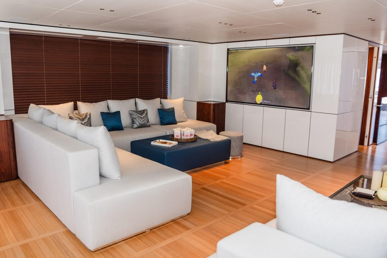a living room with a large window aboard TOSUN Yacht for Sale