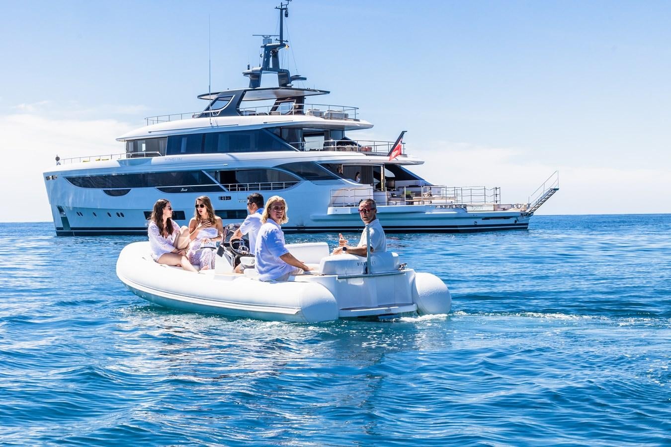 a group of people on a boat aboard TOSUN Yacht for Sale