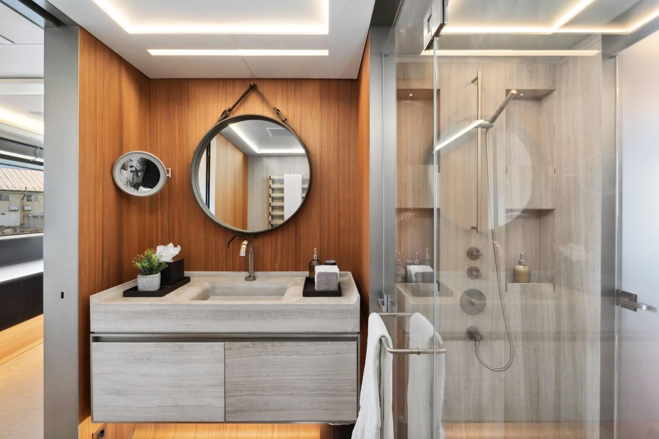 a bathroom with a large mirror aboard GLOBAS Yacht for Sale