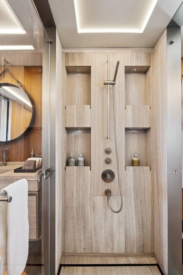 a bathroom with a mirror and a sink aboard GLOBAS Yacht for Sale