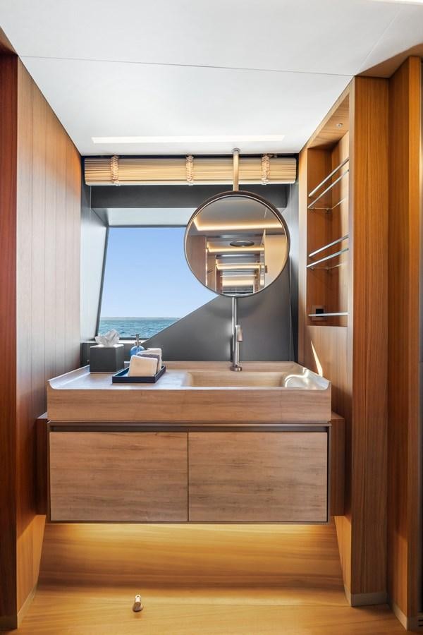 a bathroom with a large mirror aboard GLOBAS Yacht for Sale