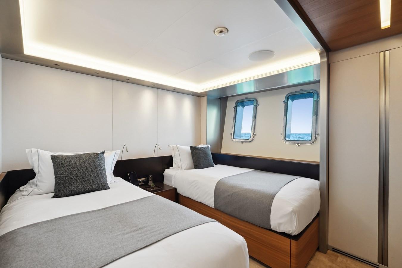a room with two beds aboard GLOBAS Yacht for Sale
