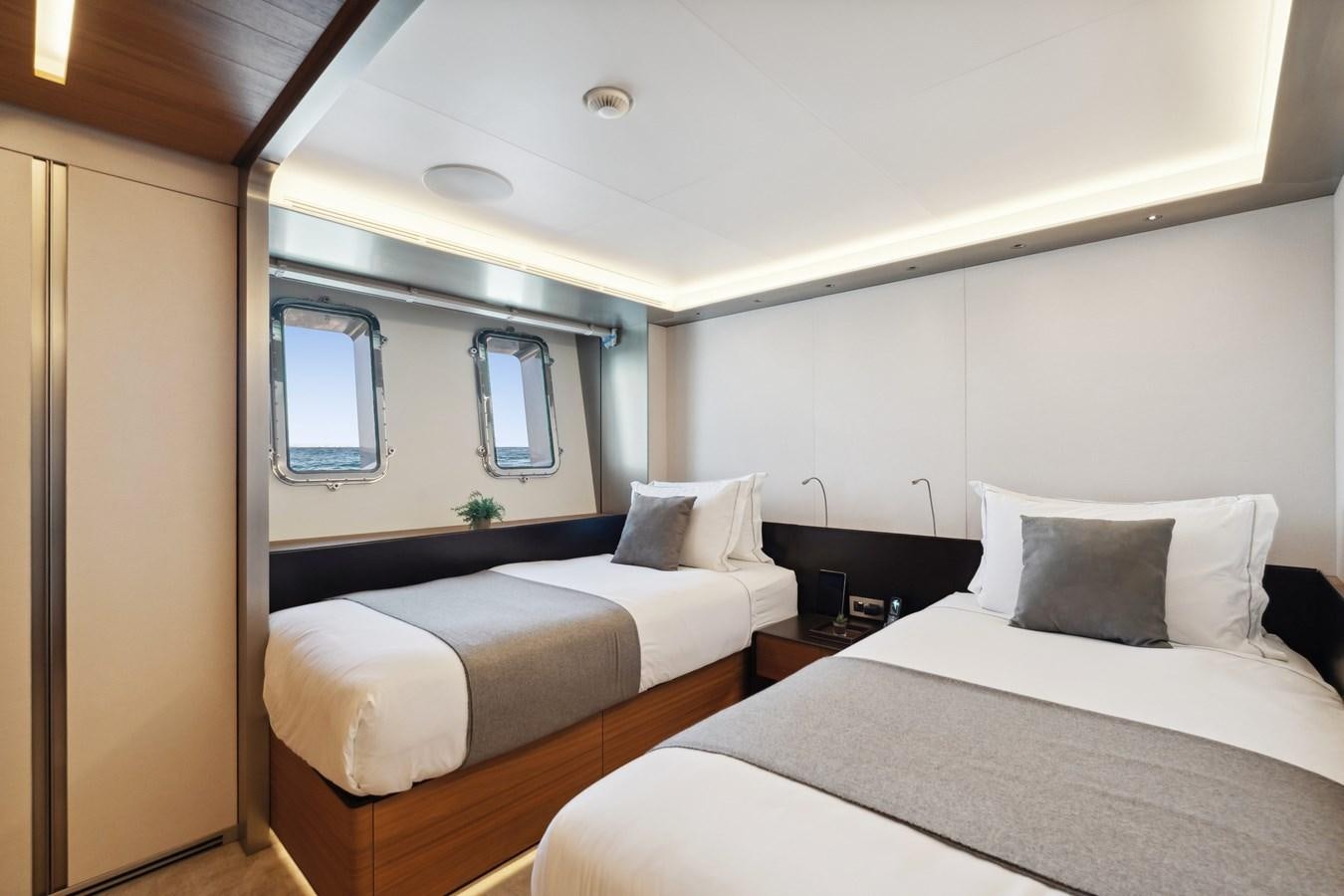 a couple of beds in a room aboard GLOBAS Yacht for Sale