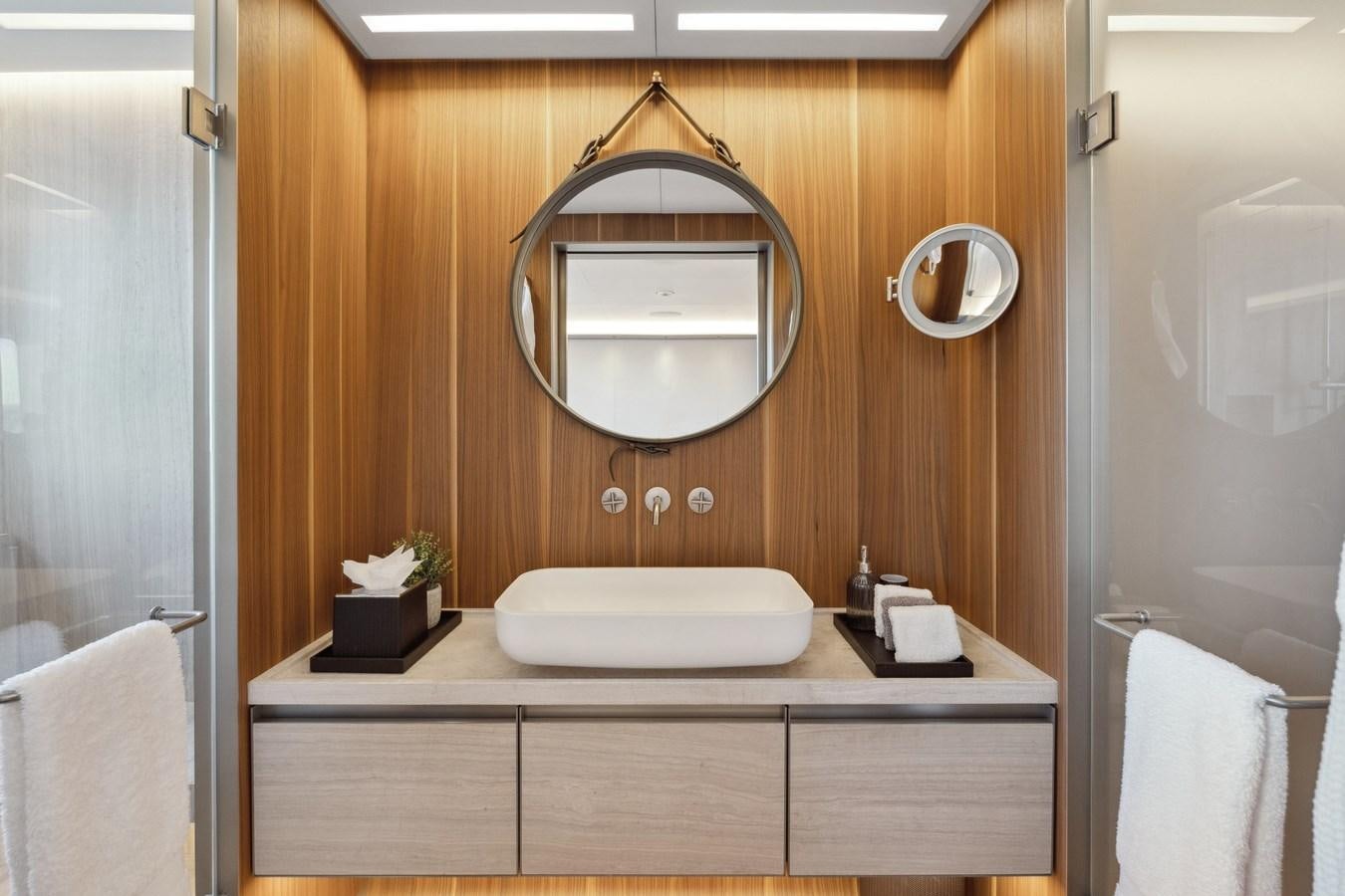 a bathroom with a large mirror aboard GLOBAS Yacht for Sale