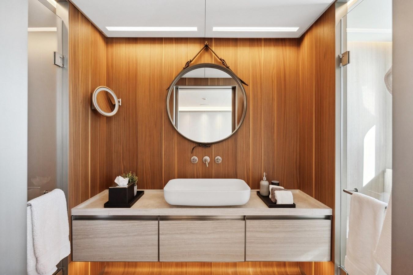 a bathroom with a large mirror aboard GLOBAS Yacht for Sale