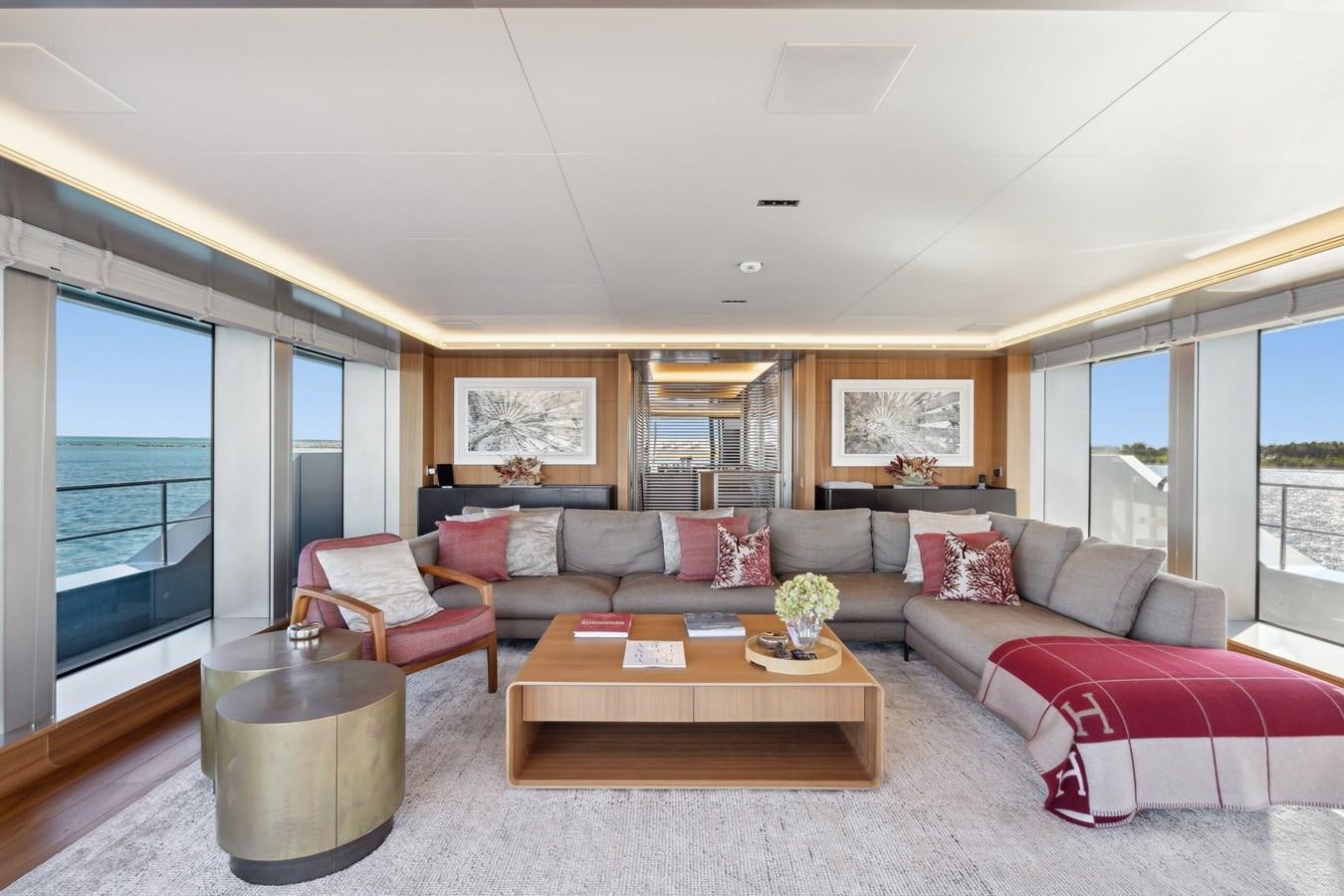 a living room with a large window aboard GLOBAS Yacht for Sale