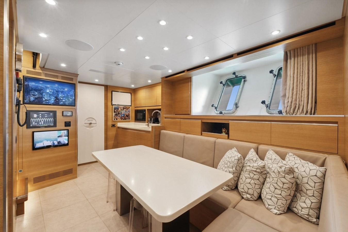 a living room with a large mirror aboard GLOBAS Yacht for Sale