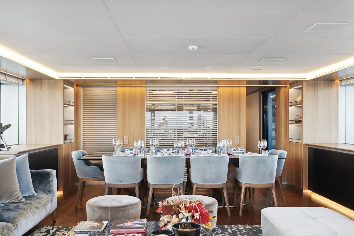 a large dining room with a large table and chairs aboard GLOBAS Yacht for Sale