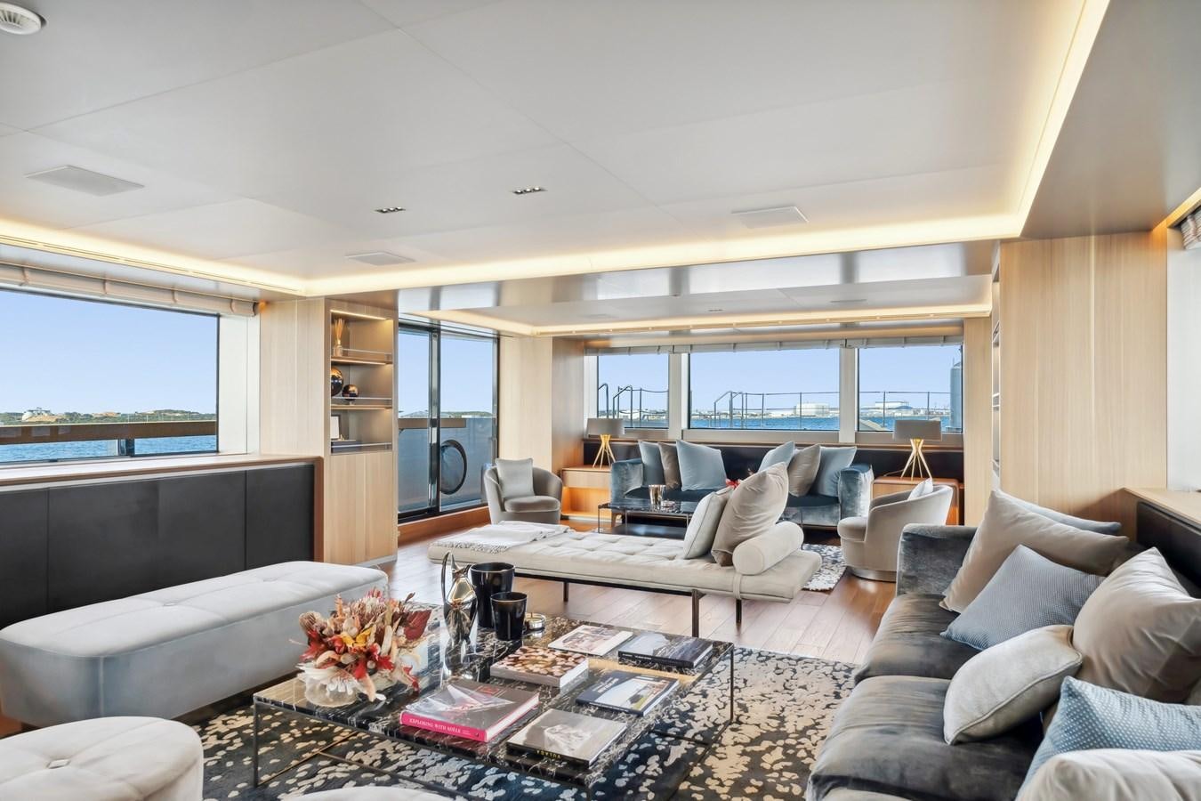 a living room with a large window aboard GLOBAS Yacht for Sale