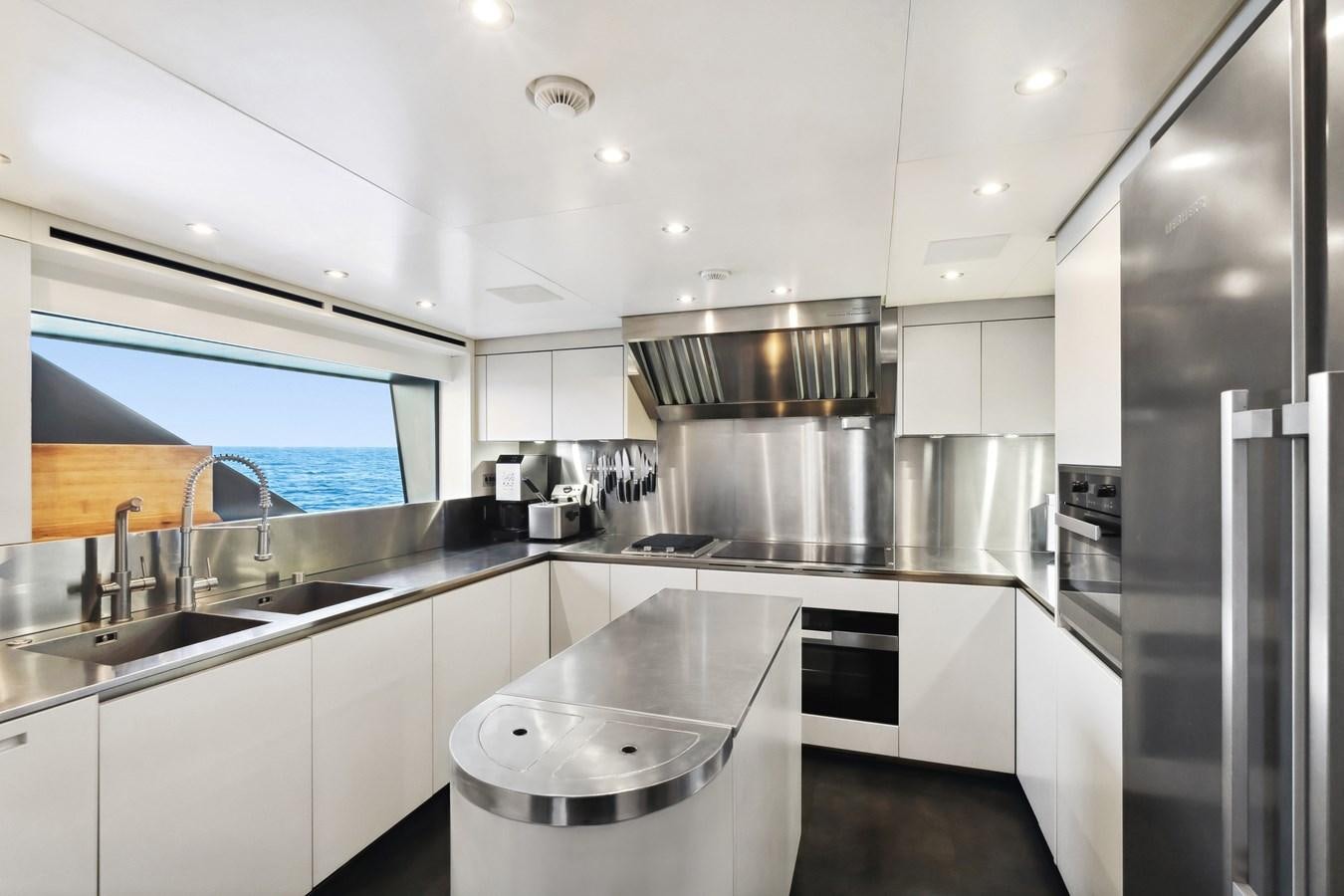 a kitchen with stainless steel appliances aboard GLOBAS Yacht for Sale