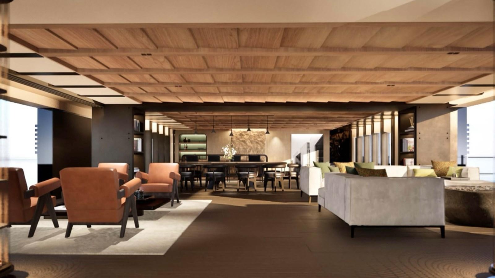 a large room with a couch and a table aboard SUPERNOVA 60 Yacht for Sale