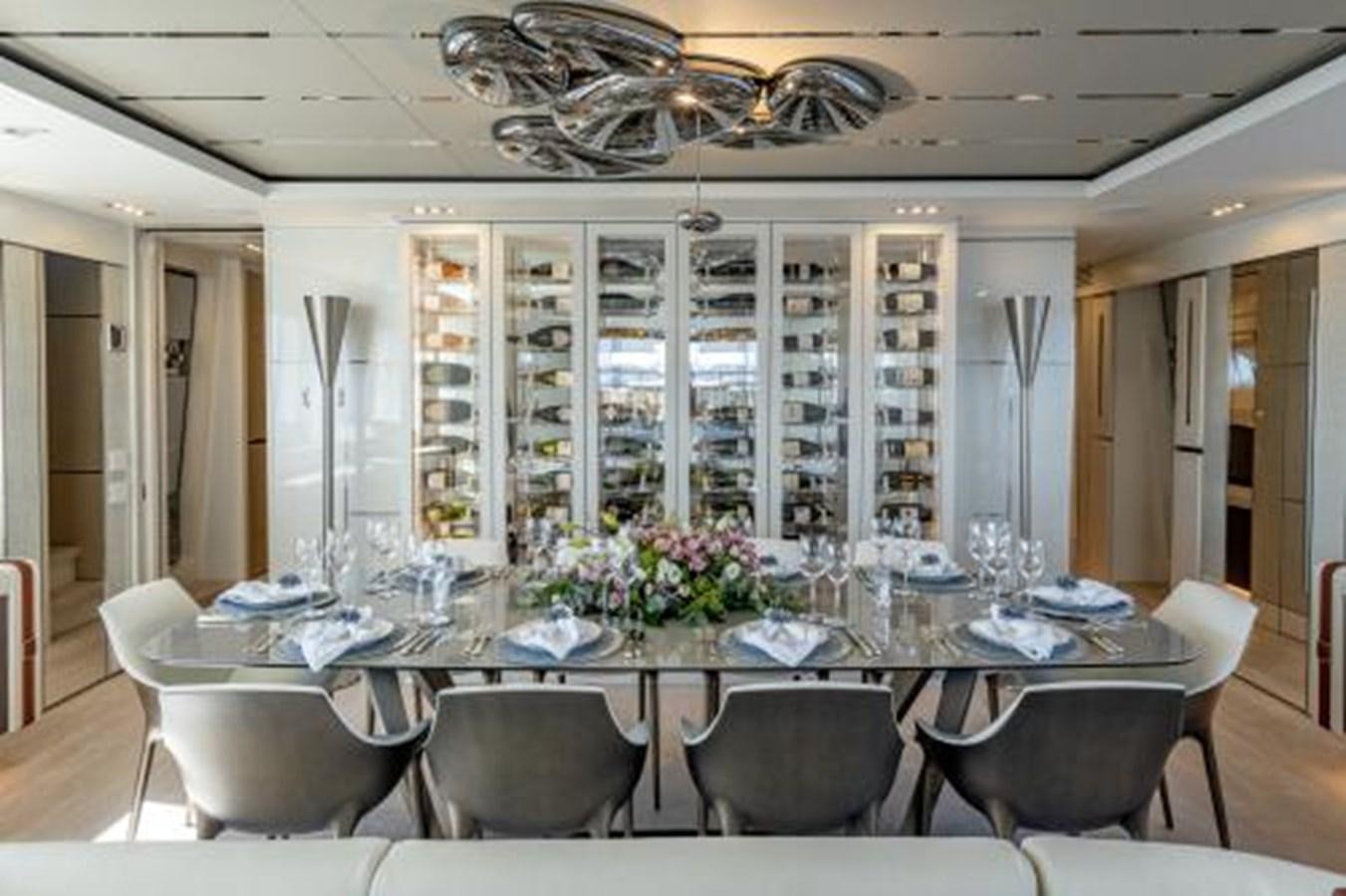 a large dining room with a large table and chairs aboard CABO Yacht for Sale