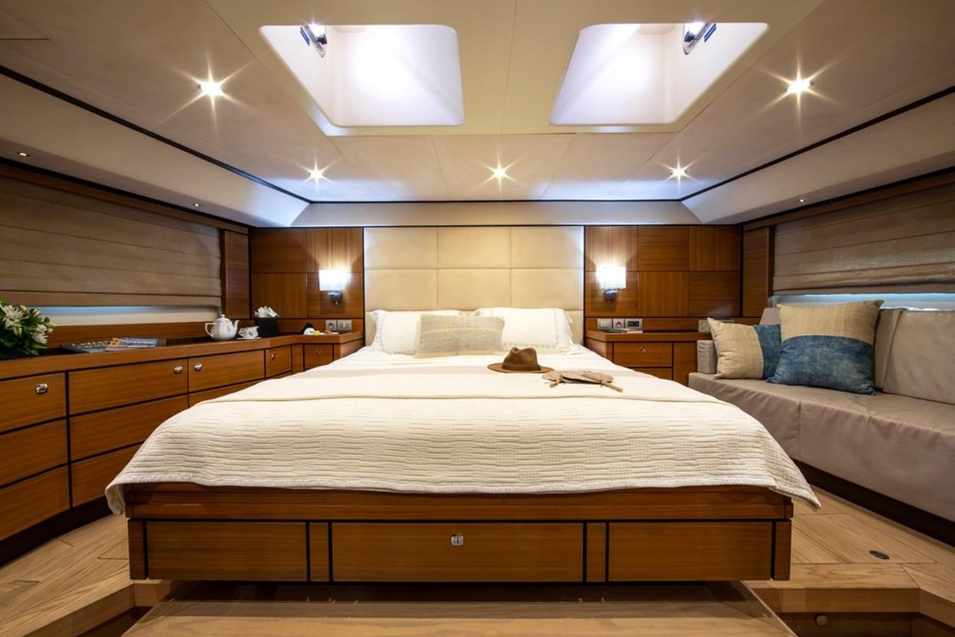 a hotel room with a bed and a couch aboard PATEA Yacht for Sale