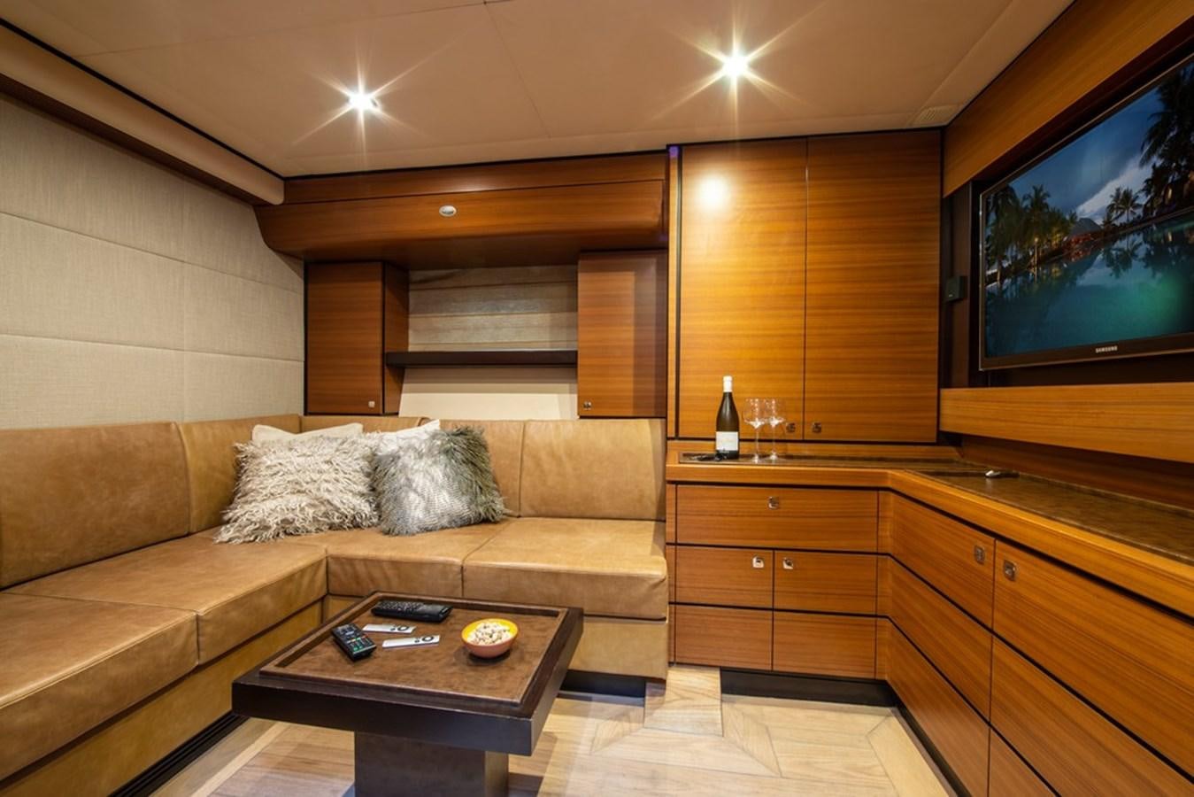 a living room with a couch and a tv aboard PATEA Yacht for Sale