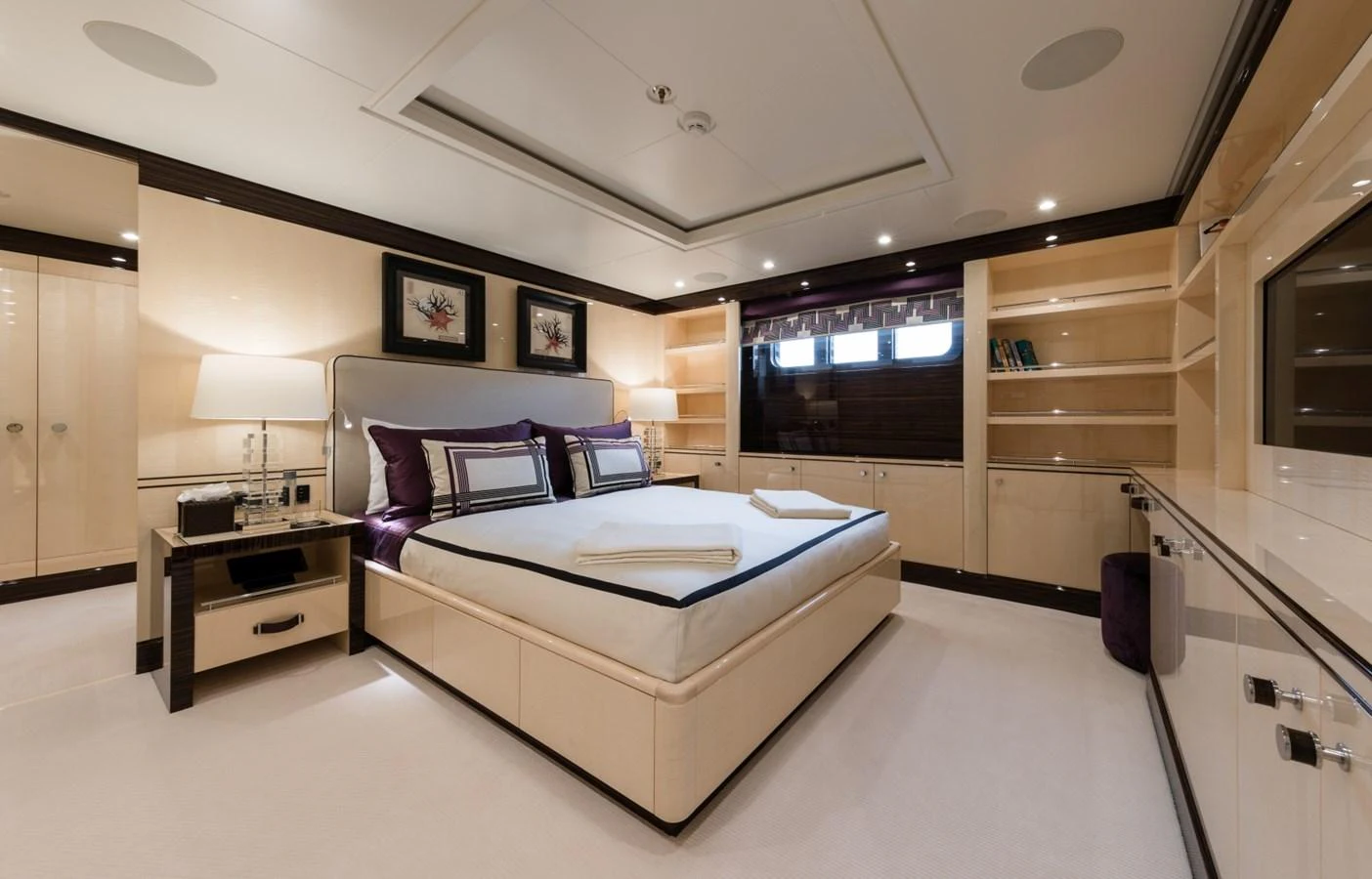 a large bedroom with a large bed aboard LILI Yacht for Sale