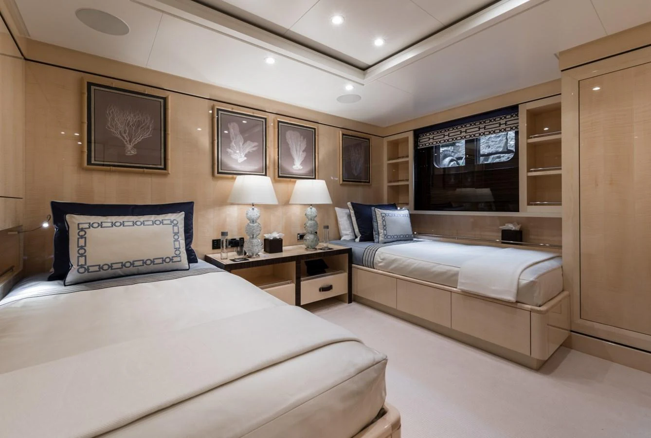 a room with two beds aboard LILI Yacht for Sale