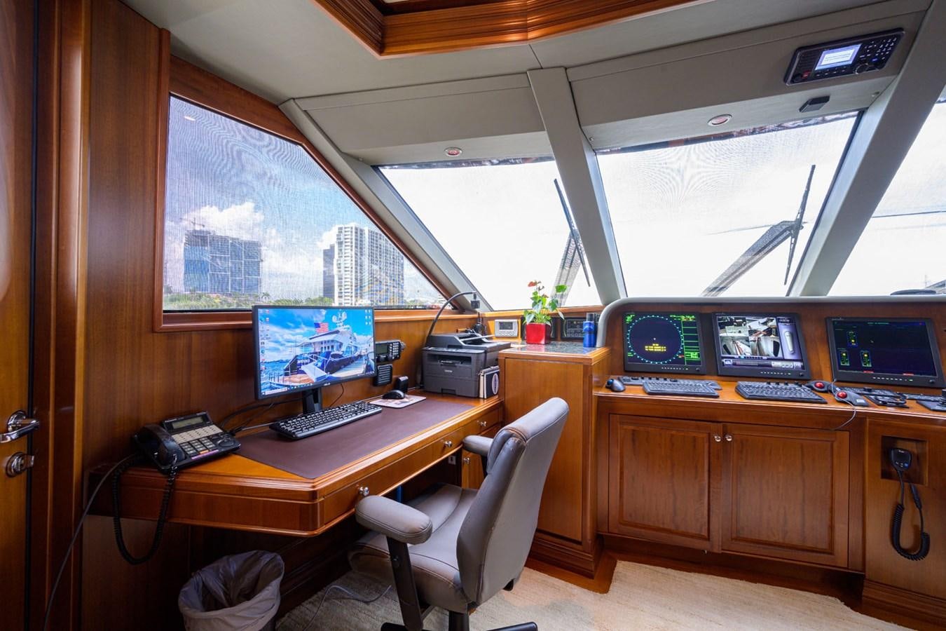 a room with computers and monitors aboard IMPETUOUS Yacht for Sale